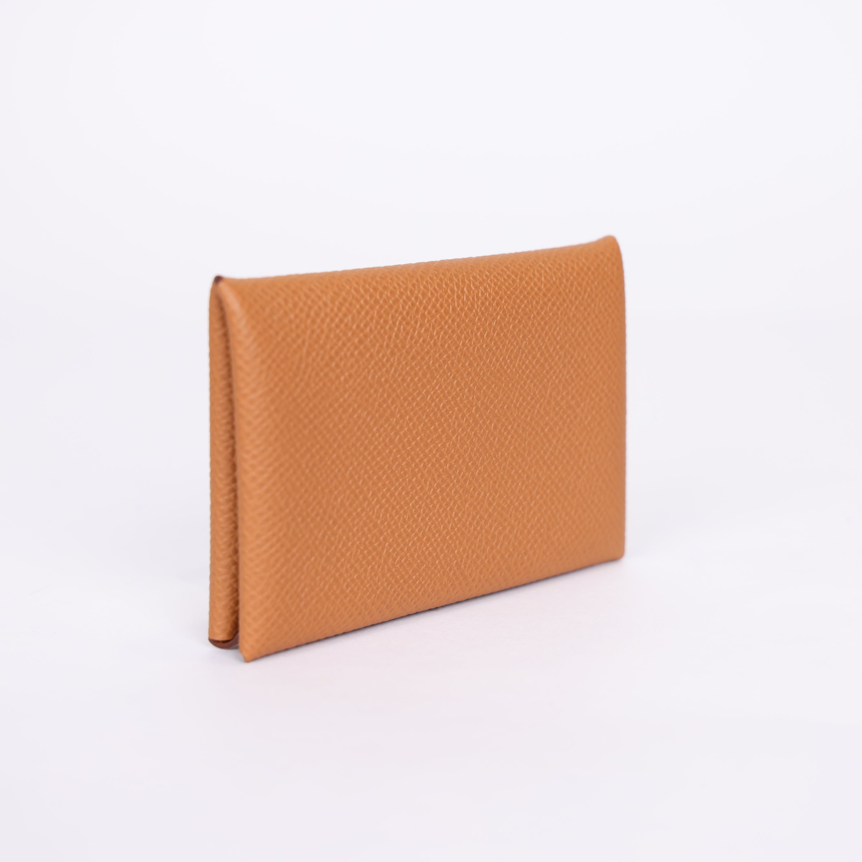 PRE OWNED- HERMES Epsom Calvi Card Case in Gold J0401B62131