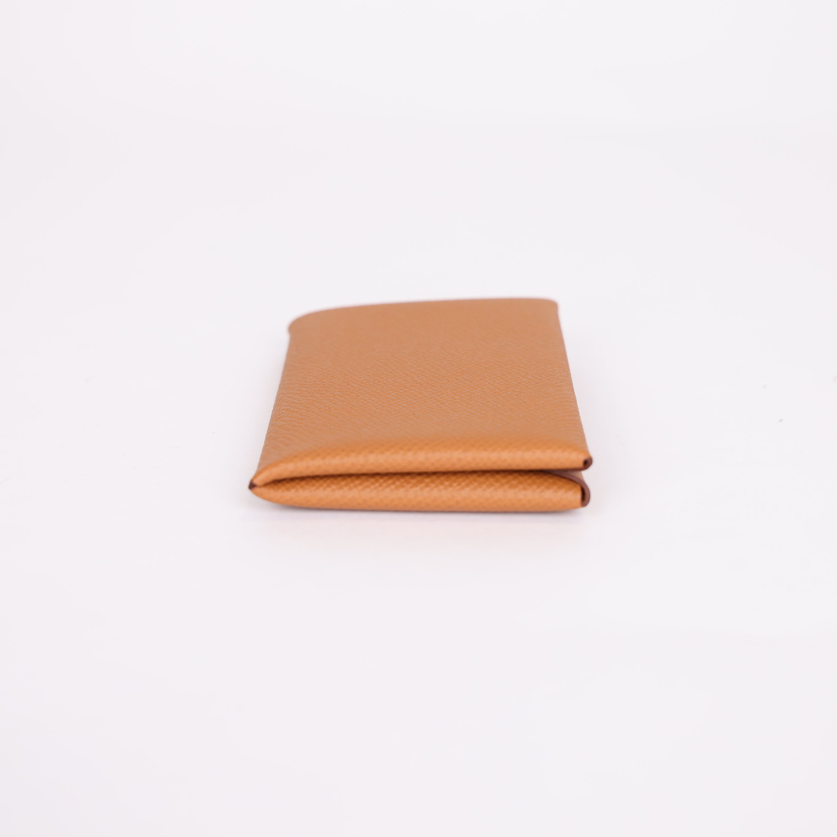 PRE OWNED- HERMES Epsom Calvi Card Case in Gold J0401B62131