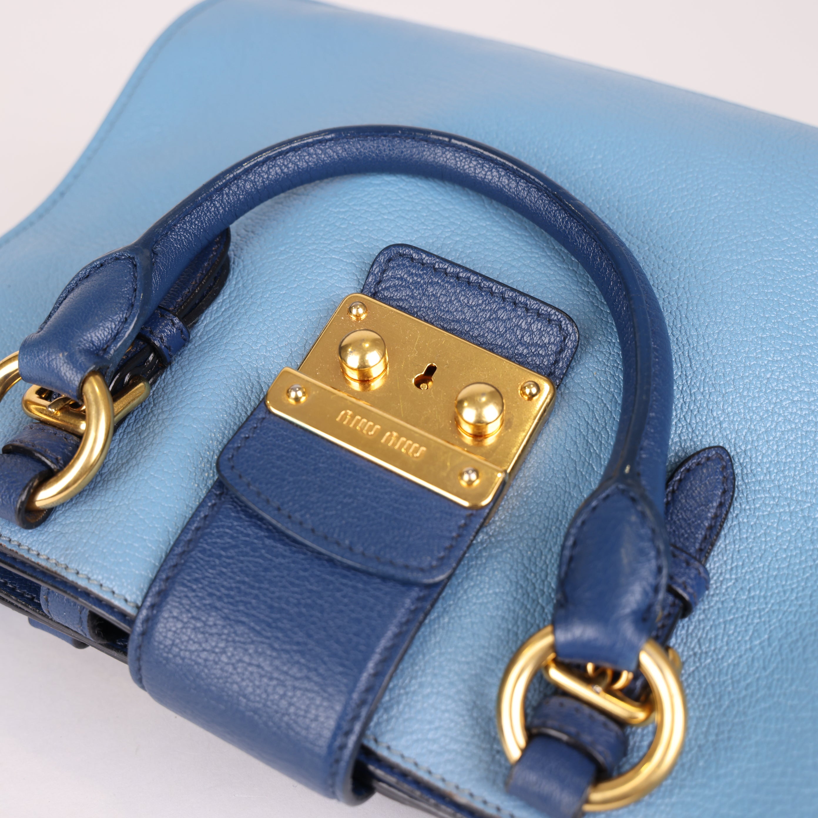 PRE OWNED- Miu Miu Blue Leather Top Handle Bag with Gold-Tone Hardware