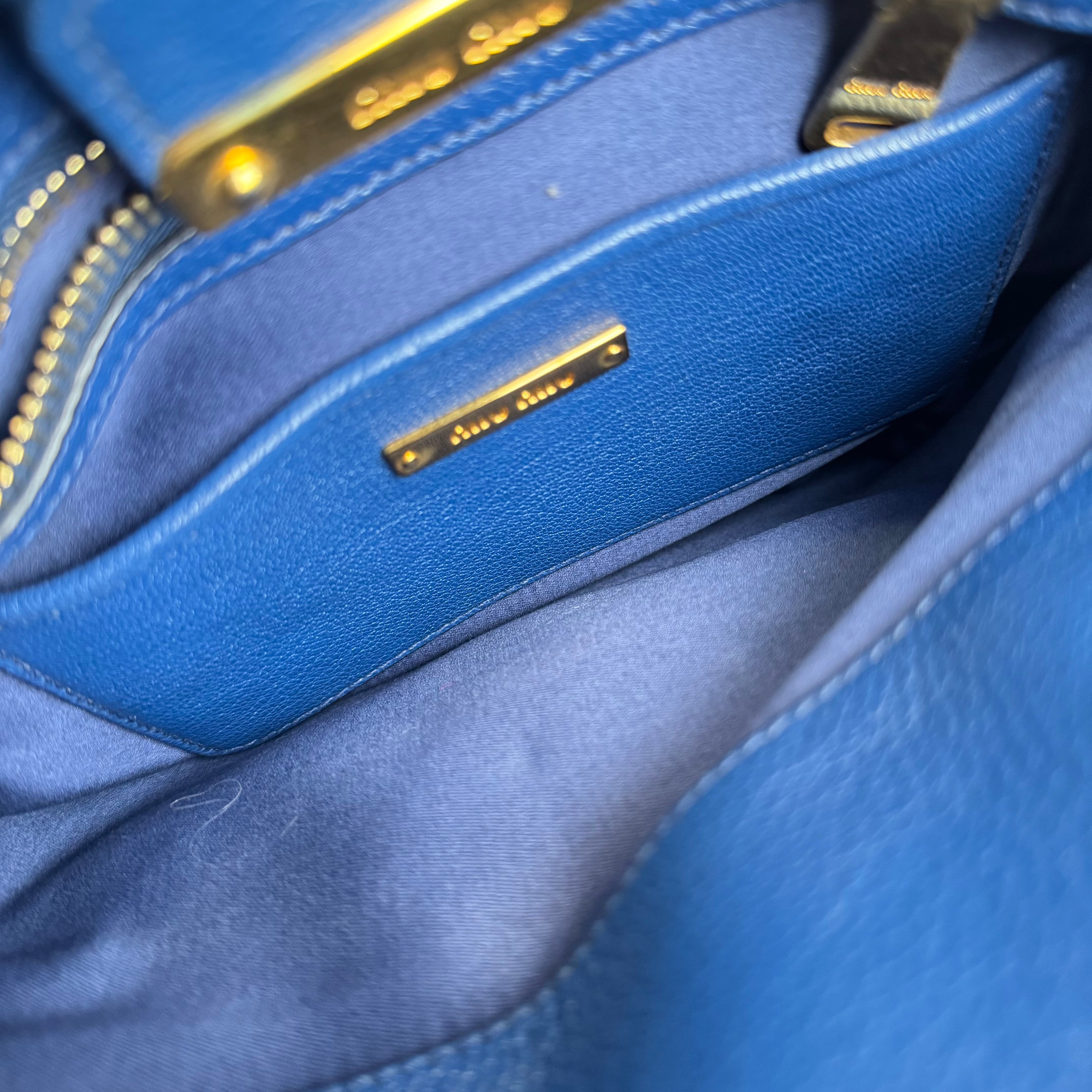 PRE OWNED- Miu Miu Blue Leather Top Handle Bag with Gold-Tone Hardware