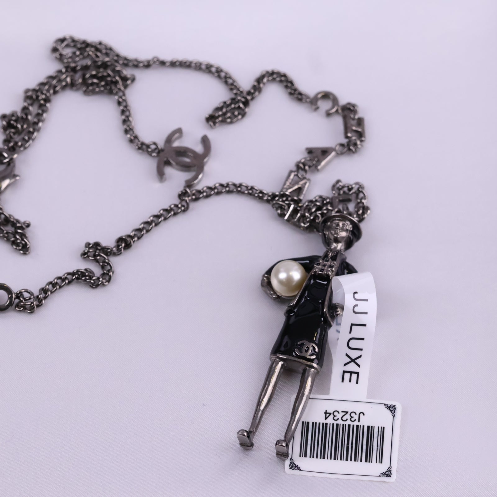 J3234 Chanel Pendant Necklace CC Coco Mademoiselle Figurine Pendant | Pre-Owned Excellent Gold-tone Logo Metal