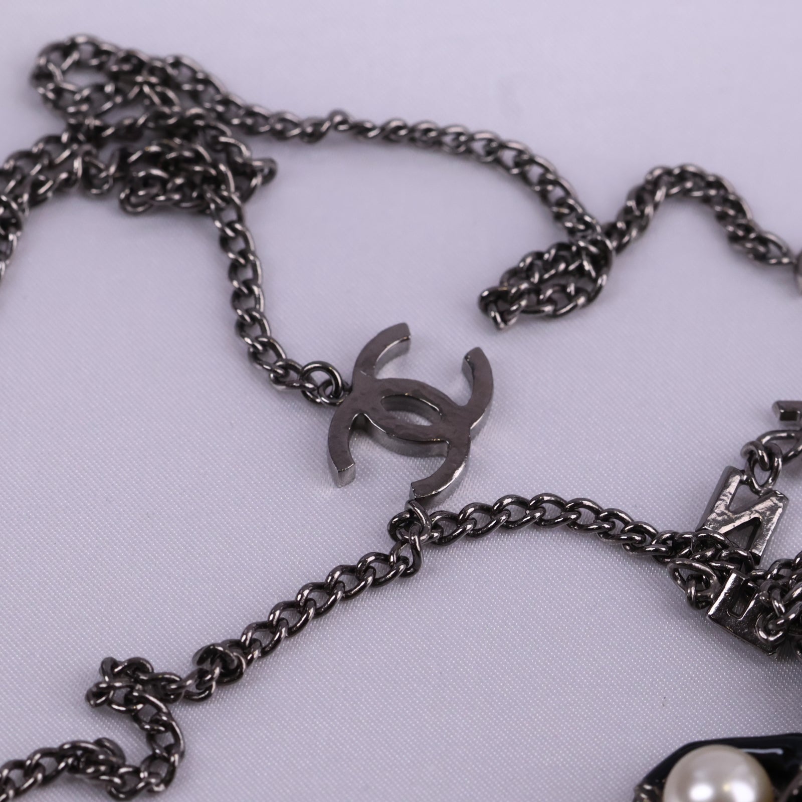 J3234 Chanel Pendant Necklace CC Coco Mademoiselle Figurine Pendant | Pre-Owned Excellent Gold-tone Logo Metal