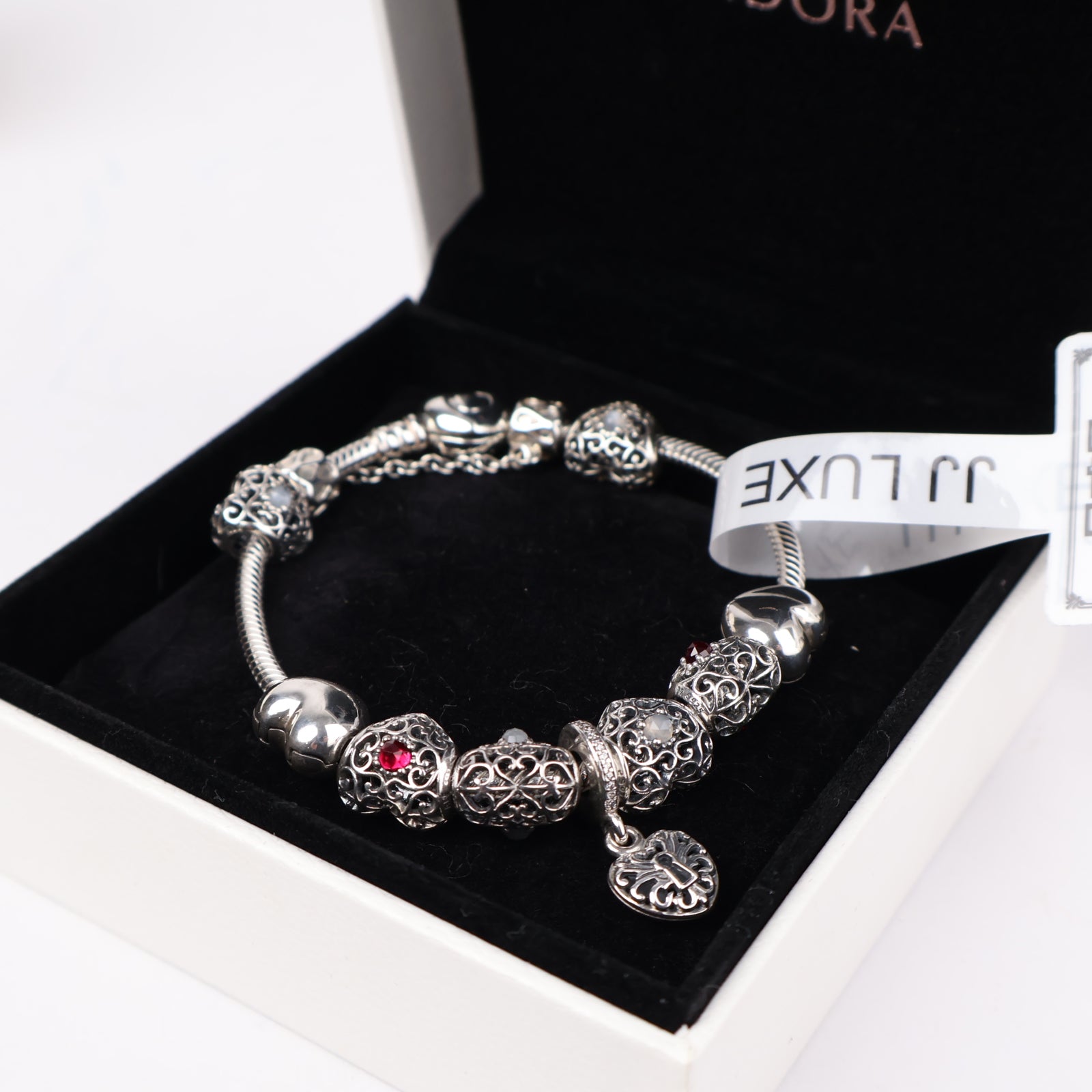 J1303 Pandora Moments Sterling Silver Bracelet with Filigree Heart and Sparkling Red Charms- Pre Owned