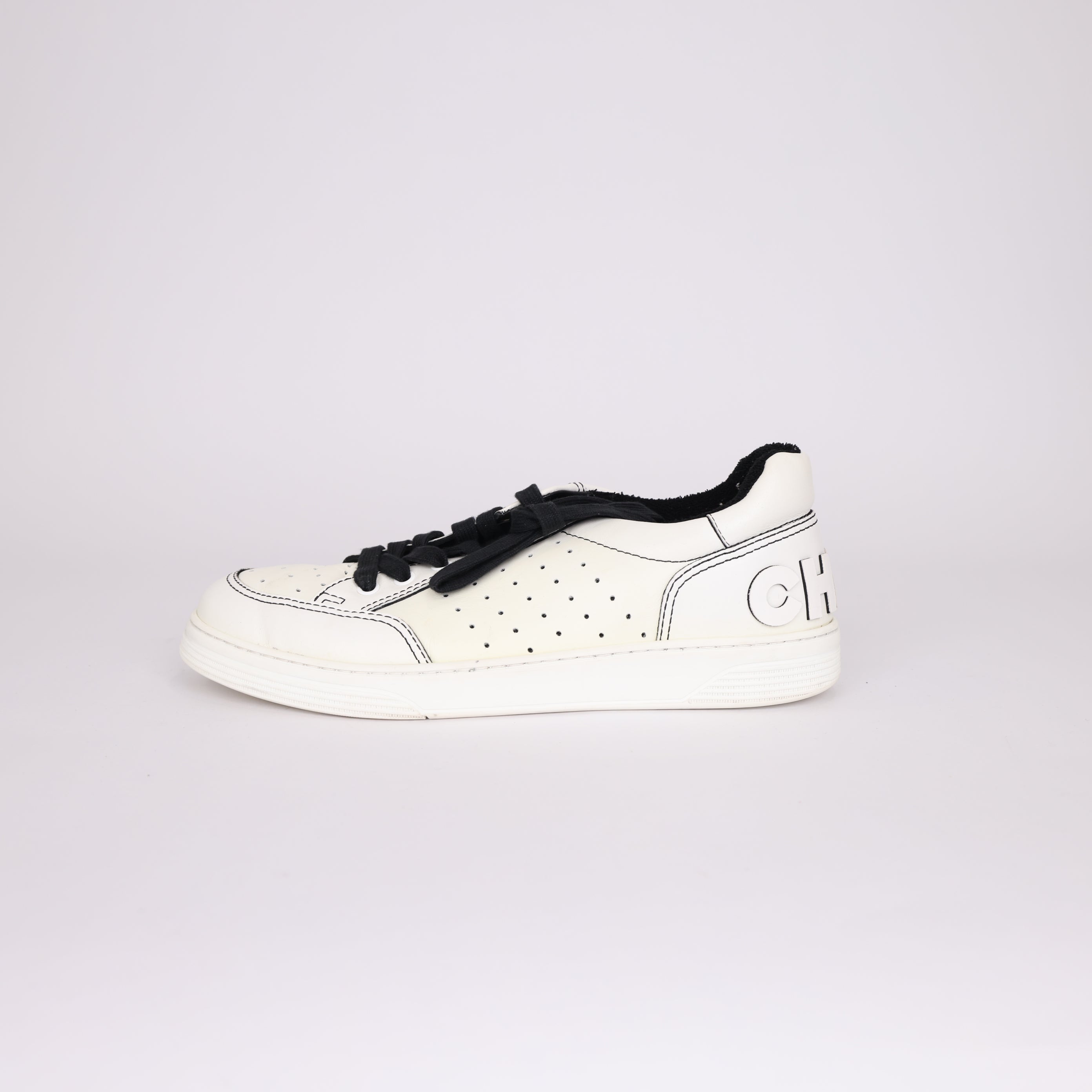 PRE OWNED- Chanel black and white embossed logo sneakers MEN'S size EU41/ UK7 J0503S55521
