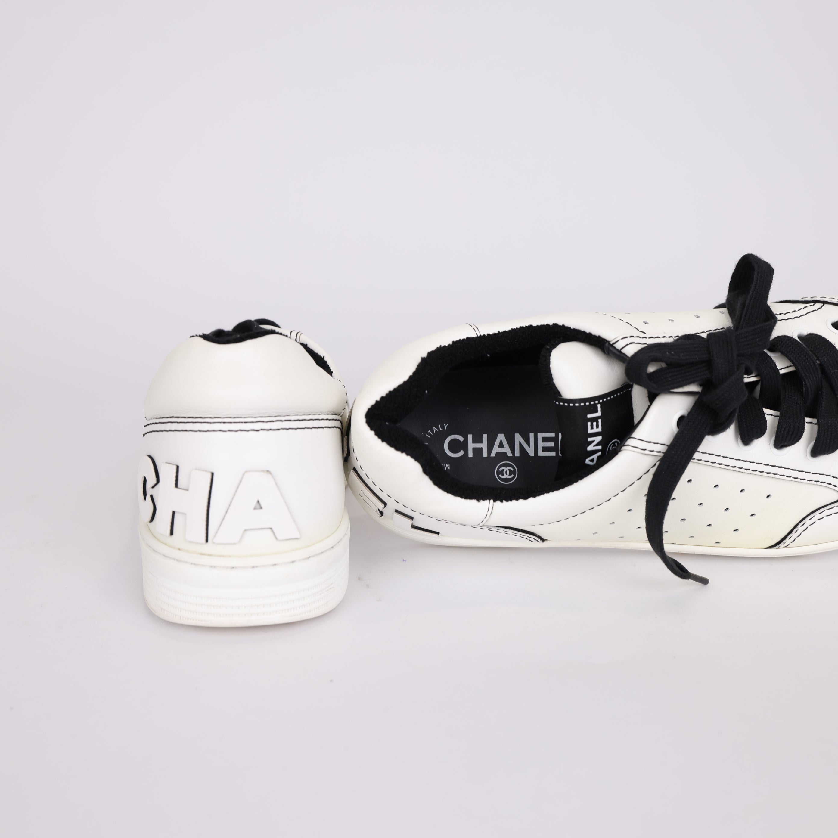 PRE OWNED- Chanel black and white embossed logo sneakers MEN'S size EU41/ UK7 J0503S55521