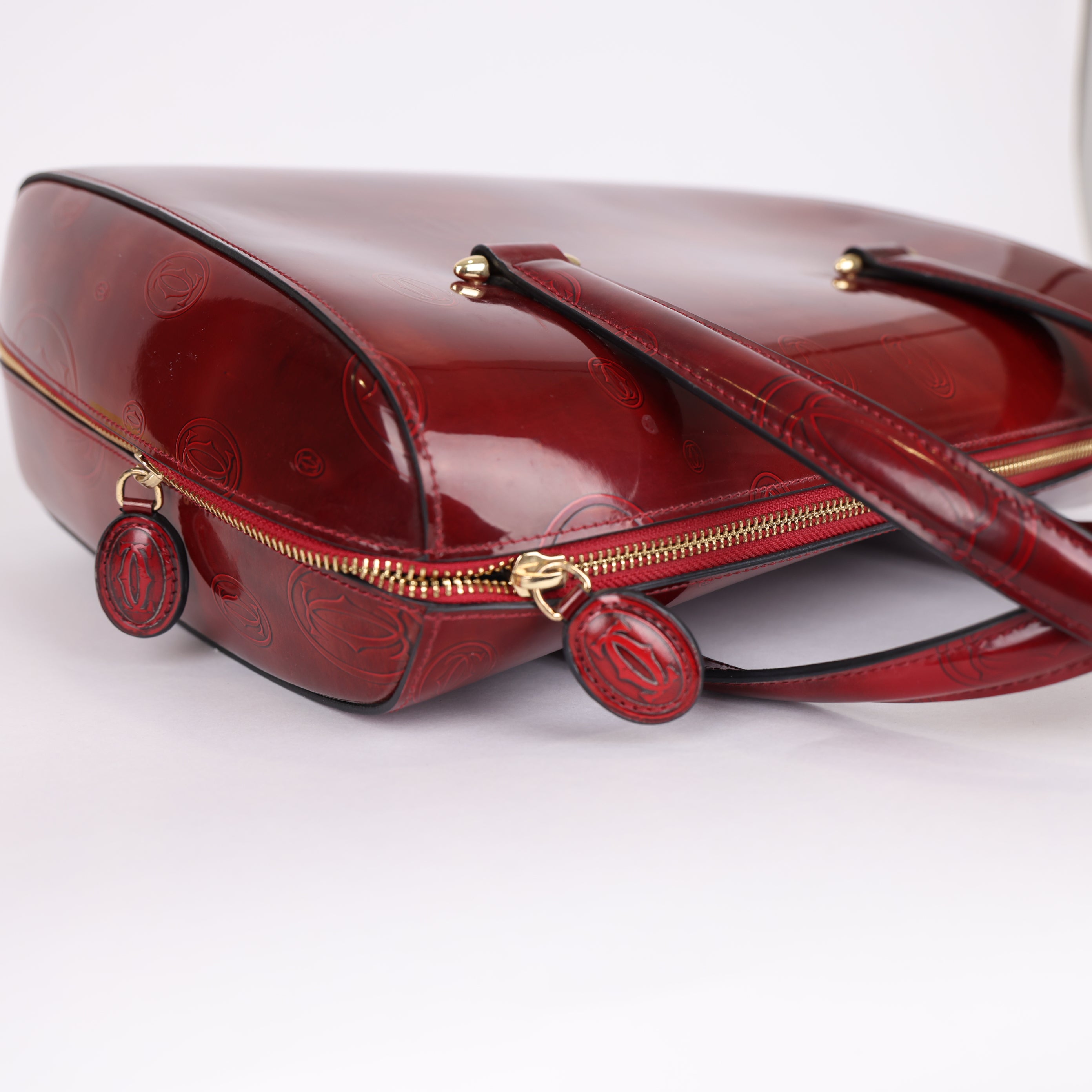 PRE OWNED-  Cartier red embossed handbag J0575B65241