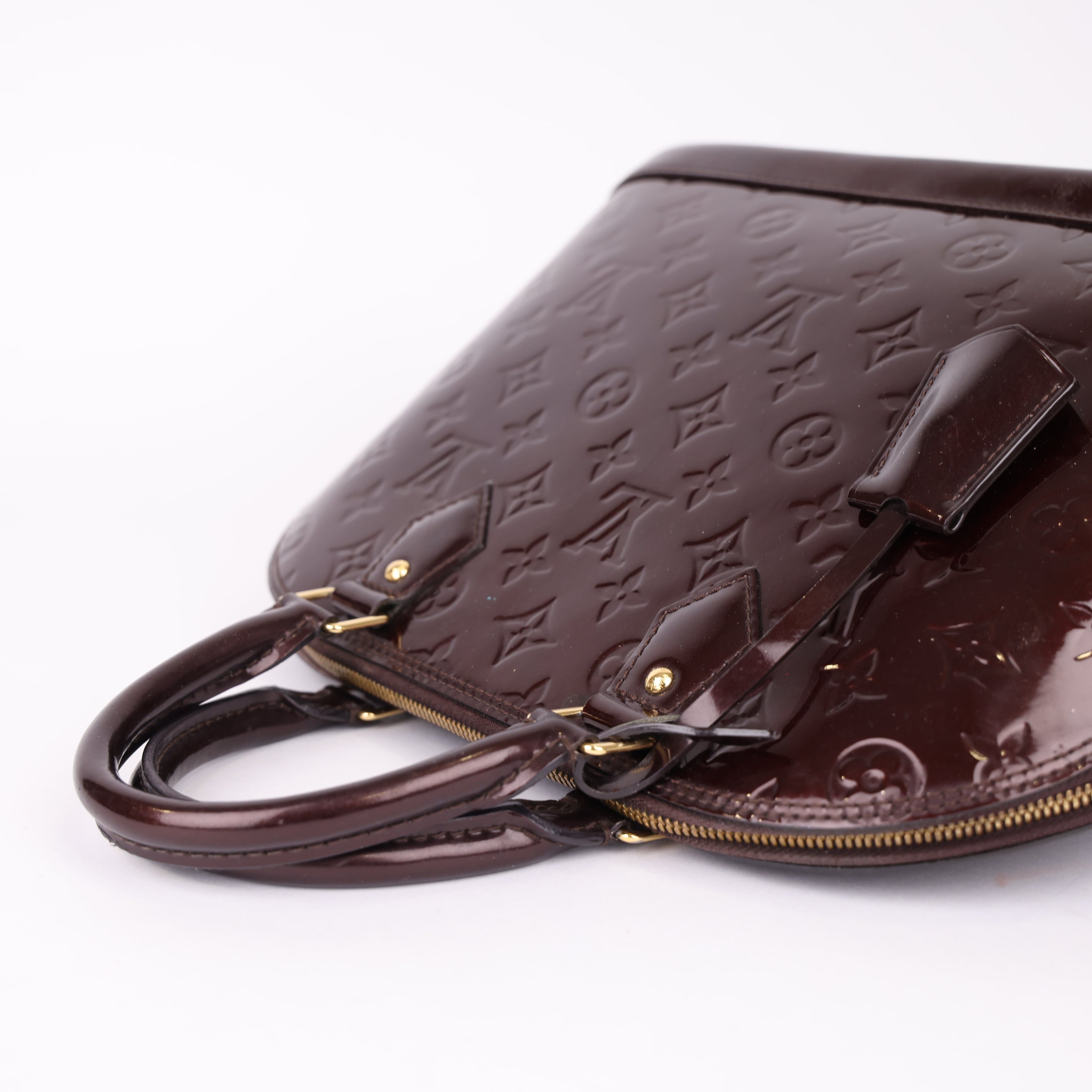 J1995 Louis Vuitton Alma PM in burgundy patent leather Pre-Owned