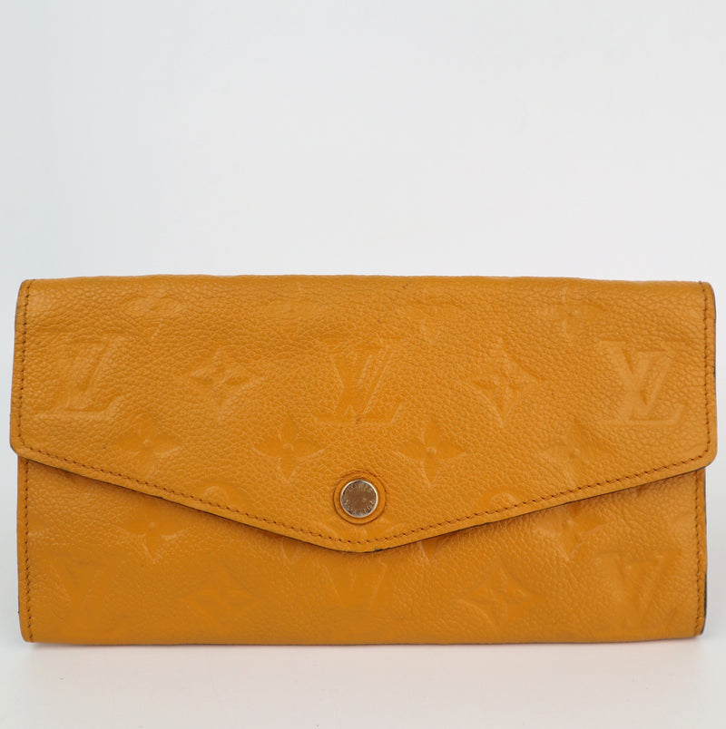 C2200 Louis Vuitton Long Wallet Monogram Empreinte Long Wallet | Pre-Owned Very Good Safran Yellow embossed leather