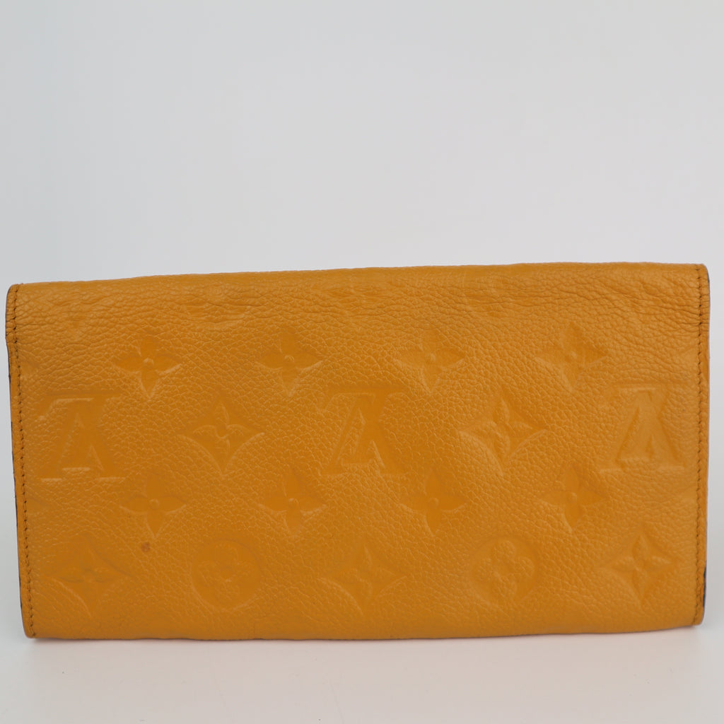 C2200 Louis Vuitton Long Wallet Monogram Empreinte Long Wallet | Pre-Owned Very Good Safran Yellow embossed leather