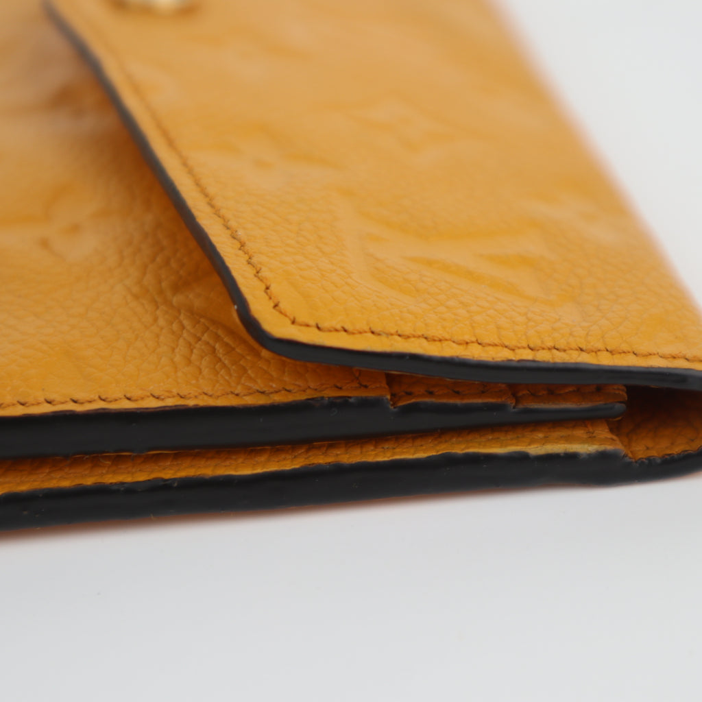 C2200 Louis Vuitton Long Wallet Monogram Empreinte Long Wallet | Pre-Owned Very Good Safran Yellow embossed leather