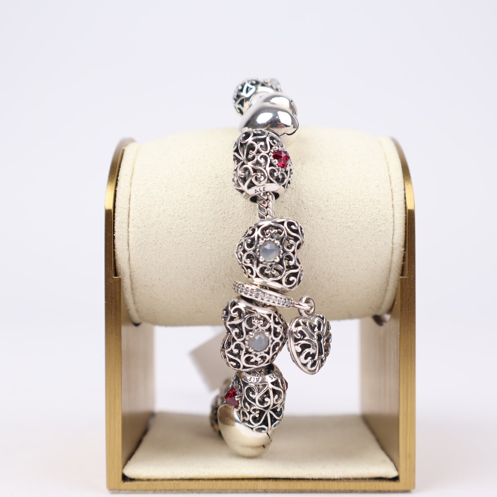 J1303 Pandora Moments Sterling Silver Bracelet with Filigree Heart and Sparkling Red Charms- Pre Owned